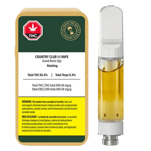 Front-facing shot of the 1:1 Vape Cartridge next to its Woody Nelson Country Club labeled 1 g carton, both shown on a white background.