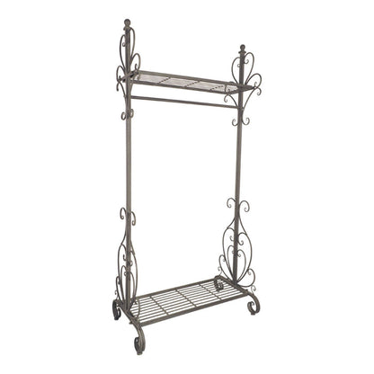 The Arlette Coat Rack Rail is an elegant unit with two open iron shelves and ornate scrollwork on the sides, finished in antique silver.