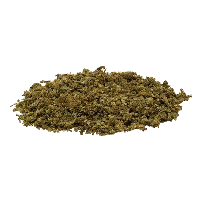 Low-angle view of a loose pile of green-brown shredded herb labeled Fruit Stripez sitting on a white background.