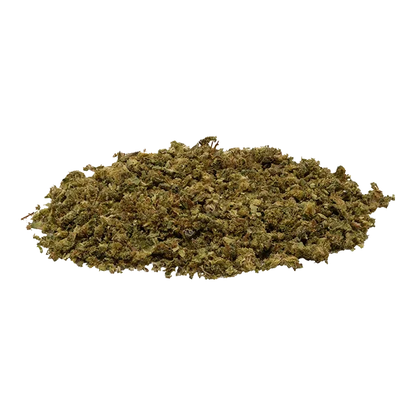 Low-angle view of a loose pile of green-brown shredded herb labeled Fruit Stripez sitting on a white background.