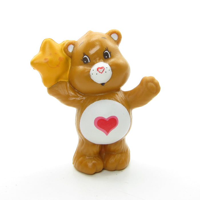 Tenderheart Bear listening to a friendly star miniature figurine